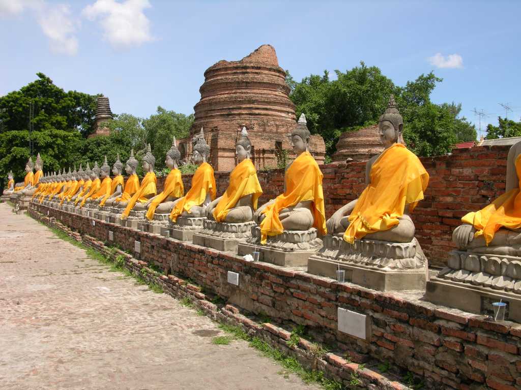 Bangkok 05 05 Ayutthaya Wat Yai Chai Mongkol Row of Buddha Statues There are many restored Buddha statues surrounding the chedi at Wat Yai Chai Mongkol in Ayutthaya.